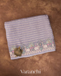 Lavender Tissue Striped and Pichwai Embroidered Border Pure Kora Silk Saree — Folded