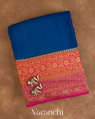 Peacock Blue Floral Bordered Pure Crepe Silk Handloom Saree