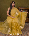 Muted Yellow Paisley Applique and Scalloped Bordered Pure Kora Silk Saree — Draped